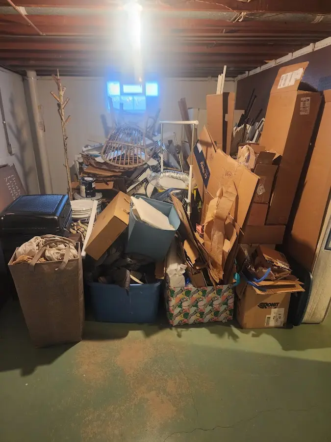 Roll-off dumpster container at job site for Yard Waste Dumpster Rental in Plympton